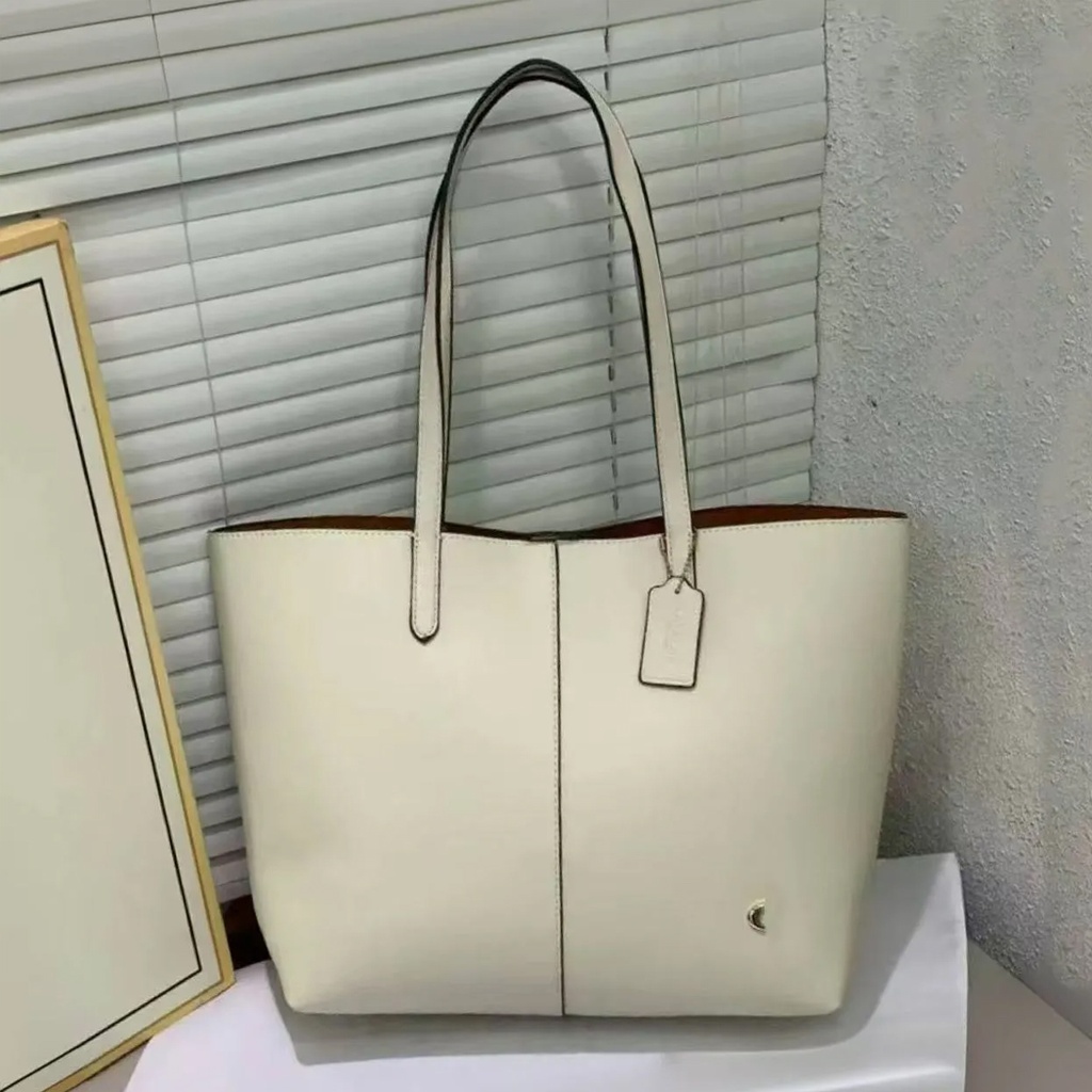 Cartera Coach de cuero para mujer.