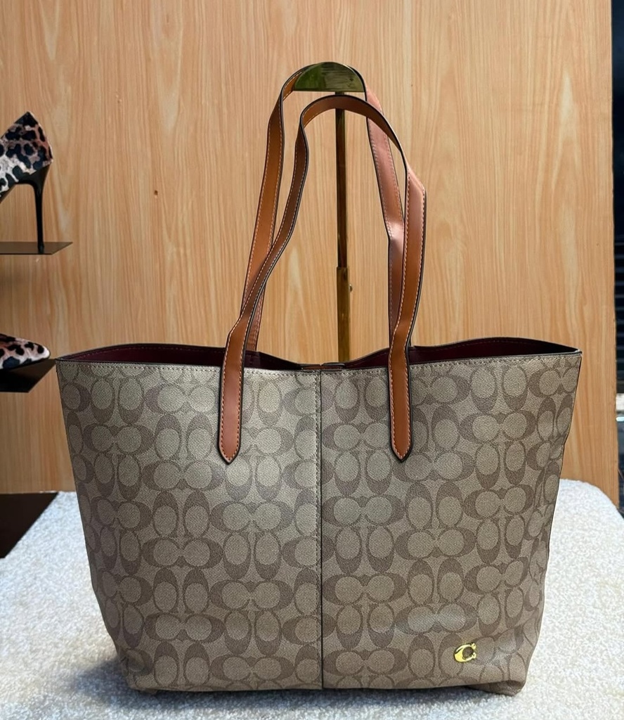 Cartera Coach de cuero para mujer.