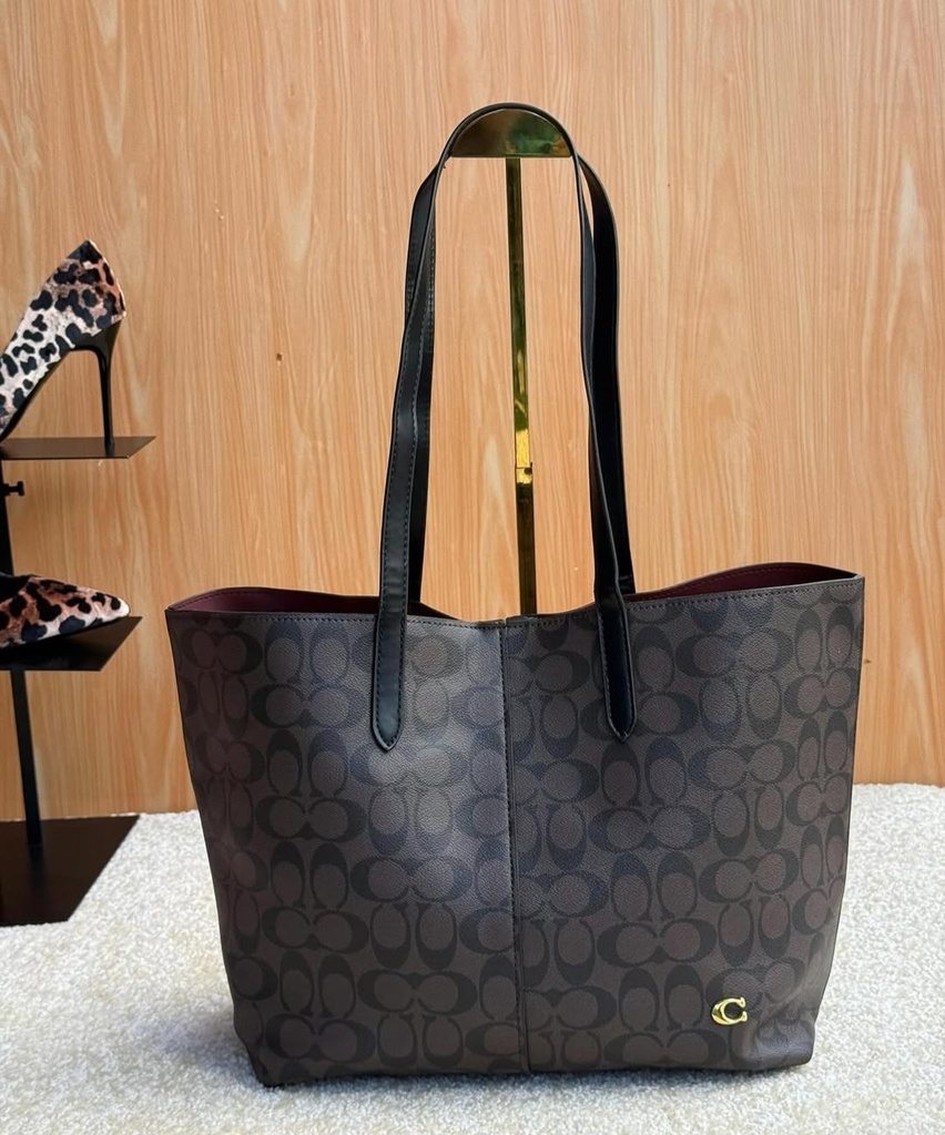 Cartera Coach de cuero para mujer.