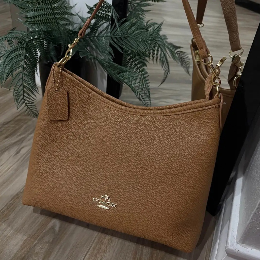 Cartera Coach de cuero para mujer.