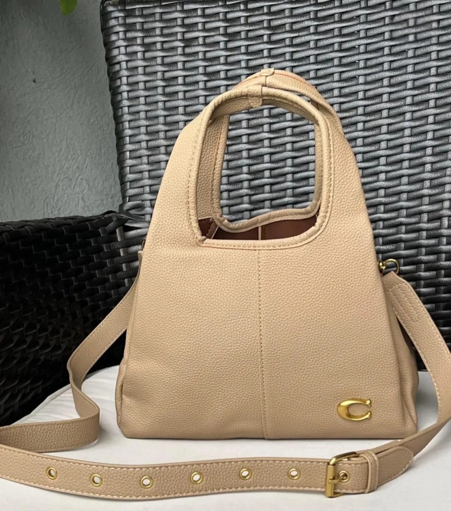 Cartera COACH de mano para mujer.