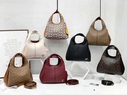 Cartera COACH de mano para mujer.